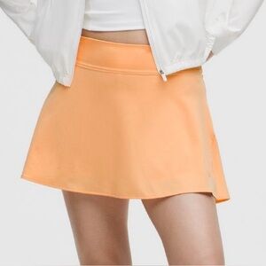 Peach Rock Melon Lululemon lightweight high rise tennis skirt, size 6